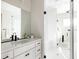 Elegant bathroom featuring a walk-in shower and modern vanity at 10270 E 62Nd Pl, Denver, CO 80238