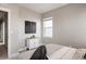 Bedroom with white cabinet and large window at 10270 E 62Nd Pl, Denver, CO 80238