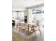 Bright dining area with a modern table and chairs, adjacent to the kitchen at 10270 E 62Nd Pl, Denver, CO 80238