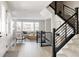 Bright and spacious entryway with modern staircase and natural light at 10270 E 62Nd Pl, Denver, CO 80238