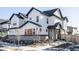 Stunning two-story home with white siding and gray accents at 10270 E 62Nd Pl, Denver, CO 80238