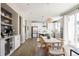 Spacious kitchen featuring white cabinets, stainless steel appliances, and an island at 10270 E 62Nd Pl, Denver, CO 80238