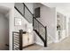 Modern staircase with sleek metal railing and light-colored wood at 10270 E 62Nd Pl, Denver, CO 80238