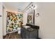 Well-lit bathroom with an ornate mirror, attractive vanity, and a floral shower curtain that adds a touch of elegance at 10685 W Apishapa Pass, Littleton, CO 80127