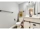 Cozy bathroom features gray walls, a modern vanity, and sleek black hardware at 10685 W Apishapa Pass, Littleton, CO 80127