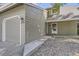 Traditional townhome featuring a two-car garage, classic siding, and welcoming entryway at 10685 W Apishapa Pass, Littleton, CO 80127