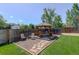 Backyard gazebo with seating area, stone path, and well-maintained lawn at 7877 W 110Th Dr, Westminster, CO 80021