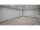 Spacious basement with neutral walls, carpet, and good lighting at 7877 W 110Th Dr, Westminster, CO 80021