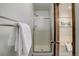 Bathroom with glass shower, neutral walls, and view to the soaking tub at 7877 W 110Th Dr, Westminster, CO 80021