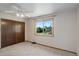 Bedroom with a large window and closet space at 7877 W 110Th Dr, Westminster, CO 80021