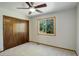 Bedroom featuring a window with a view and a ceiling fan at 7877 W 110Th Dr, Westminster, CO 80021