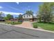 Charming two-story home with a brick driveway and well-maintained landscaping, offering a welcoming curb appeal at 7877 W 110Th Dr, Westminster, CO 80021