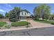 Charming two-story home with a brick driveway and well-maintained landscaping, offering a welcoming curb appeal at 7877 W 110Th Dr, Westminster, CO 80021