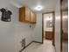 Laundry room featuring a built-in cabinet and is conveniently located near a half-bath at 7877 W 110Th Dr, Westminster, CO 80021