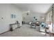 Bright and airy living room featuring neutral colors, plush carpeting, and large windows at 7877 W 110Th Dr, Westminster, CO 80021