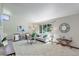 Cozy living room showcasing neutral decor, a large window, and comfortable seating at 7877 W 110Th Dr, Westminster, CO 80021