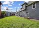 A large grassy backyard is featured in this shot with the house to the side at 253 N Lincoln St, Denver, CO 80203