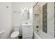 Updated bathroom featuring white vanity, neutral paint, and a shower and tub combination at 253 N Lincoln St, Denver, CO 80203
