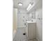 This bathroom features black and white tile floors, a modern vanity, and a shower at 253 N Lincoln St, Denver, CO 80203