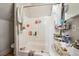 Functional bathroom features a bathtub/shower, a sink, and white colored walls at 253 N Lincoln St, Denver, CO 80203