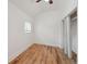 Bedroom with wood floors, a closet, and a window with natural light at 253 N Lincoln St, Denver, CO 80203