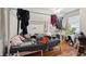 Cluttered bedroom featuring natural light and hardwood flooring at 253 N Lincoln St, Denver, CO 80203