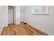 Bright bedroom with wood floors, a closet, and a window with natural light at 253 N Lincoln St, Denver, CO 80203