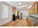 Modern kitchen equipped with stainless steel appliances, wood cabinets and sleek countertops at 253 N Lincoln St, Denver, CO 80203