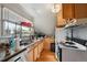 Functional kitchen featuring a stainless steel sink, wood cabinetry, and natural light at 253 N Lincoln St, Denver, CO 80203