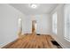 Spacious living room with wood floors, featuring an archway leading to other rooms at 253 N Lincoln St, Denver, CO 80203