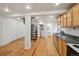 Spacious living room with spiral staircase flowing into the modern kitchen at 253 N Lincoln St, Denver, CO 80203
