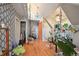 Bright living room features hardwood floors, contemporary wallpaper, and an orange door at 253 N Lincoln St, Denver, CO 80203
