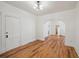 Bright living room featuring wood floors, arched doorways, and fresh white paint at 253 N Lincoln St, Denver, CO 80203