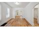 Bright living room offering wood floors, fresh paint and an open archway to the kitchen at 253 N Lincoln St, Denver, CO 80203