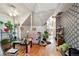 Cozy living room features hardwood floors, modern wallpaper, and access to the kitchen at 253 N Lincoln St, Denver, CO 80203