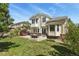Well-maintained backyard with patio, fire pit, and lush green lawn at 20928 E Hamilton Ave, Aurora, CO 80013