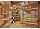 Unfinished basement area featuring exposed ceiling and shelving units at 20928 E Hamilton Ave, Aurora, CO 80013