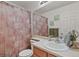 The bathroom features a single sink vanity and a shower-tub combo with a patterned curtain at 20928 E Hamilton Ave, Aurora, CO 80013