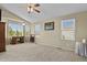 Bright bedroom with large windows, vaulted ceilings, and comfortable furniture with neutral carpet at 20928 E Hamilton Ave, Aurora, CO 80013