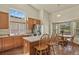 Inviting kitchen with stainless steel appliances, an island, and a dining area with bright natural light at 20928 E Hamilton Ave, Aurora, CO 80013