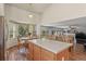 Spacious kitchen with ample counter space, island seating, and a breakfast nook overlooking the backyard at 20928 E Hamilton Ave, Aurora, CO 80013