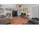 The living room has a fireplace, wood floors, and comfortable seating, creating an inviting atmosphere at 20928 E Hamilton Ave, Aurora, CO 80013