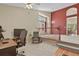 Cozy loft space with plush carpeting, neutral walls, and a lovely view overlooking the dining room at 20928 E Hamilton Ave, Aurora, CO 80013