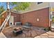 Outdoor patio area with brick exterior and cozy fire pit at 20928 E Hamilton Ave, Aurora, CO 80013