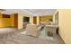 Inviting finished basement with neutral tones, plush carpeting, and comfortable seating for relaxing and entertaining at 7655 S Olive Cir, Centennial, CO 80112