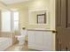 Bright bathroom features a bath tub and shower, and a neutral single vanity at 7655 S Olive Cir, Centennial, CO 80112