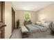 Comfortable bedroom features a large closet, neutral paint, and an accent rug at 7655 S Olive Cir, Centennial, CO 80112