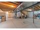 Spacious unfinished basement featuring exposed beams, ductwork, and plenty of potential at 5131 Delphinium Cir, Brighton, CO 80601