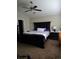 Bedroom with ceiling fan, a large bed, side tables, and carpet at 5131 Delphinium Cir, Brighton, CO 80601