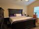 Bright bedroom with a ceiling fan, large bed, and side tables at 5131 Delphinium Cir, Brighton, CO 80601